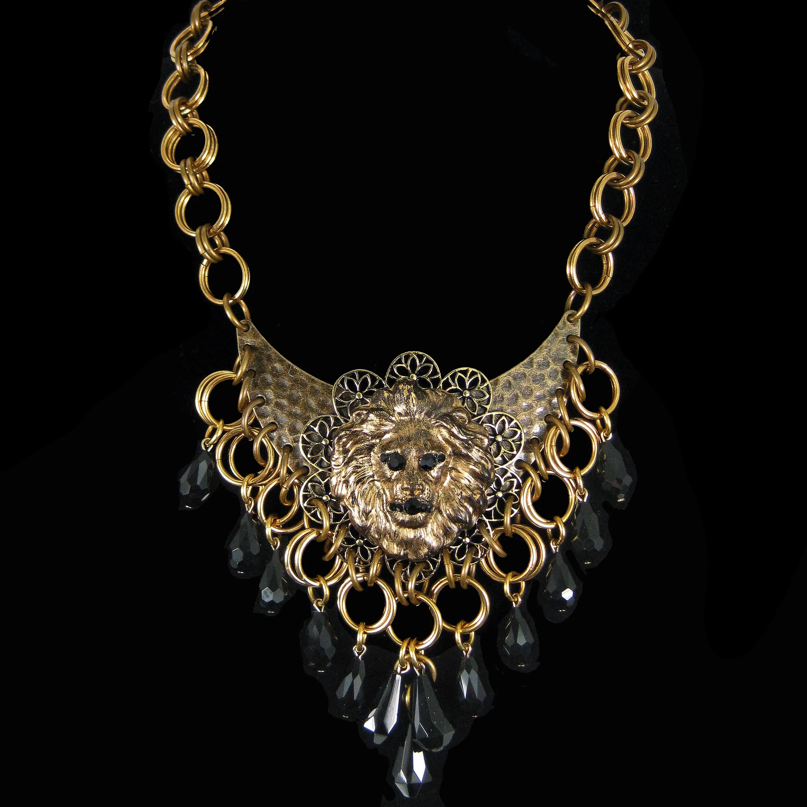 #1135n Gold Tone Filigree, Lion Head & Jet Bib Necklace